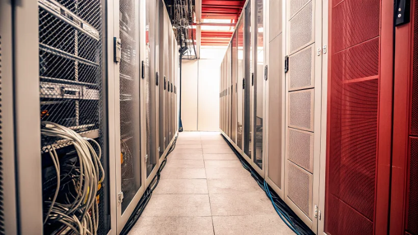 Modern data centre showing server cabinets and network equipment providing core enterprise services
